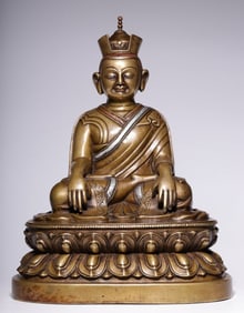 A Qing Dynasty bronze inlaid silver Karma Pakhi seated statue