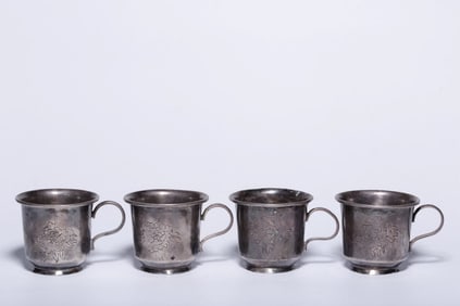 A set of four sterling silver peony pattern ear cups