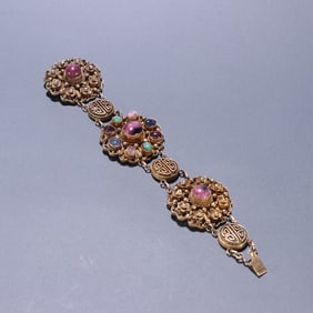A silver gilt filigree inlaid tourmaline ornament