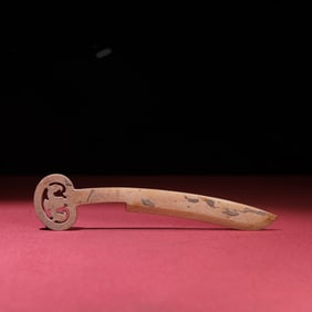 A small jade knife with gray skin