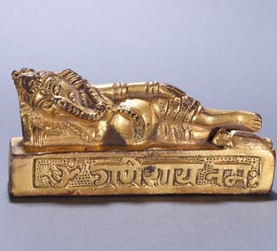 A piece of Qing bronze gilt elephant trunk God of Wealth