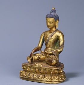 An 18th-century Tibetan Buddhist bronze gilt statue of Shakyamuni