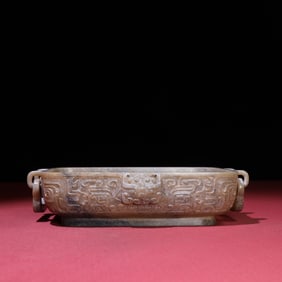 A pair of gray leather beam plates