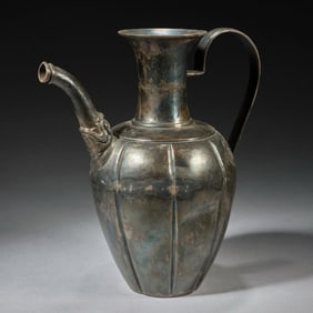 A Tang Dynasty eight-petal silver wine jug