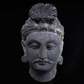 A 5th-century AD shale rock carving of the head of the Buddha of Gandhara