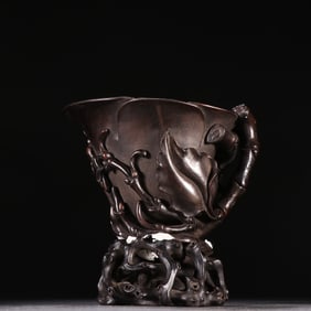 A clear rosewood orchid cup
