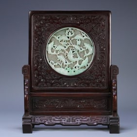 A piece of Qing Dynasty red sandalwood inlaid with jade hollow has a fish insert every year