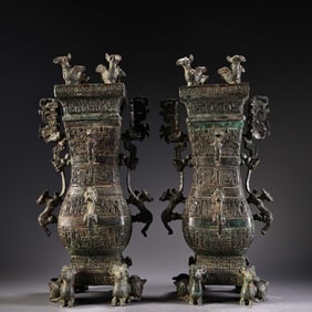 A pair of bronze square bottle jugs