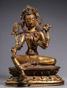 A Qing Dynasty bronze gilt gem-encrusted Tara statue