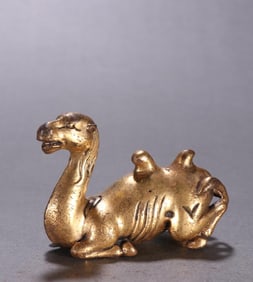 A bronze gilt camel ornament