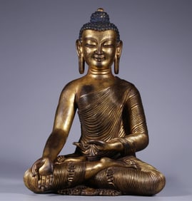 A Qing Dynasty bronze gilt statue of Shakyamuni