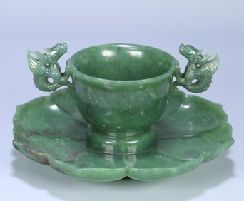 A Qing dynasty Hetian jasper double dragon ear lotus cup plate