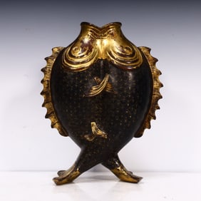 A Qing Dynasty copper Pisces flower arrangement