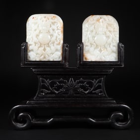 A Qing Dynasty Hetian jade double dragon play bead interstitial