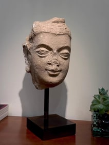 A piece of white plaster clay Buddha head