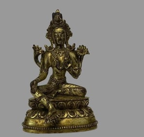 A piece of copper-gilt green Tara