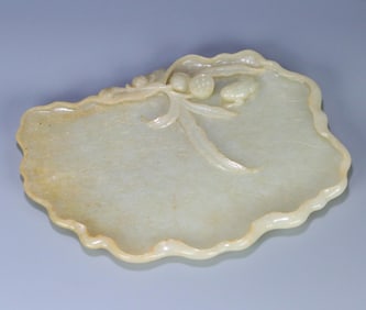 A piece of Qing Dynasty Hetian jade frog lotus leaf wash