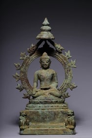 A bronze seated statue of Shakyamuni