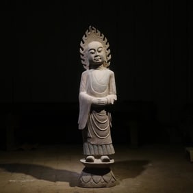 A bluestone painted Buddha statue