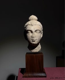 A piece of white plaster clay Buddha head