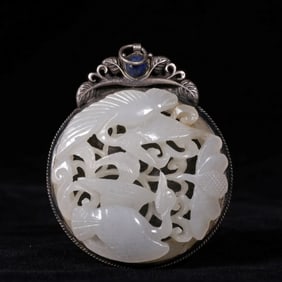 A Qing Dynasty silver inlay Hetian white jade flower and bird pattern pendant