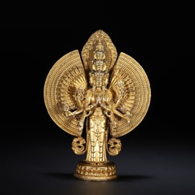 A bronze gilt thousand-armed statue of Guanyin