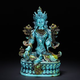 A turquoise carved Green Tara ornament