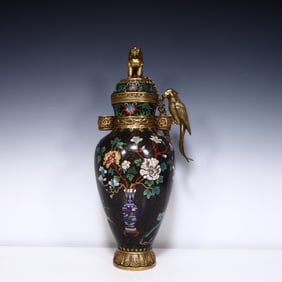 A Qing Dynasty cloisonne lion button parrot bottle