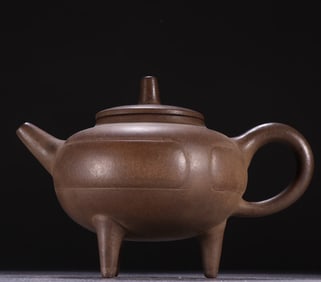 One piece of purple sand three-legged teapot