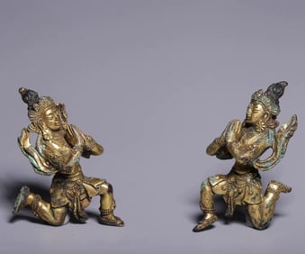 A pair of gilt bronze gold donors