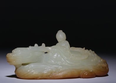 A piece of Hetian jade seed material with Piqin people riding dragon turtles