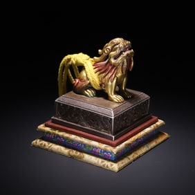 A Qing Dynasty Tibetan bronze gilt lion button seal