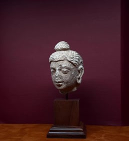 A piece of white plaster clay Buddha head