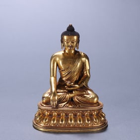 A piece of Qing bronze gilt Shakyamuni Buddha