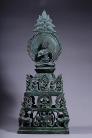 A seated bronze statue of a Vajrasattva hammer