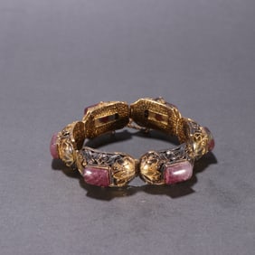 A clear silver-gilt tourmaline hand row