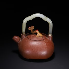 A piece of Hetian jade put the old purple clay pot