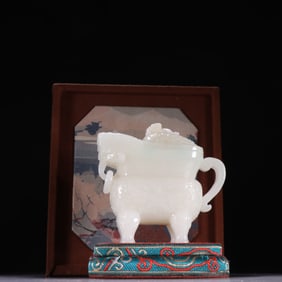 A Qing Hetian jade imitation bronze ornament