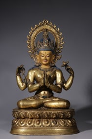 A Qing Dynasty bronze gilt four-armed Guanyin seated statue
