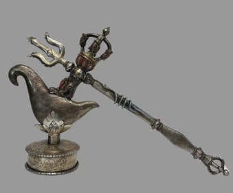 A sterling silver vajra axe artifact