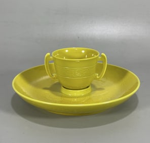 A piece of the Kangxi year of the Qing Dynasty yellow glaze carved cup