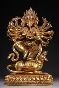 A Ming Dynasty "Ming Yongle Nianshi" bronze gilt elephant trunk God of Wealth statue