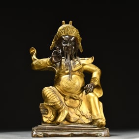 A Qing Dynasty bronze gilt statue of Guan Gong