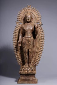 A standing statue of Alain Buddha