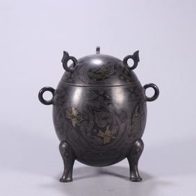 A piece of copper wrong gold and silver beast pattern cover furnace