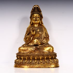 A Qing Dynasty bronze gilt lotus goddess of mercy seated ornament