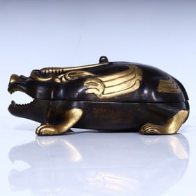 A piece of Qing Dynasty bronze beast lid box