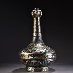 A bronze wrong gold and silver garlic vase