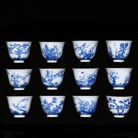A set of Qing Kangxi blue and white twelve flower god cups