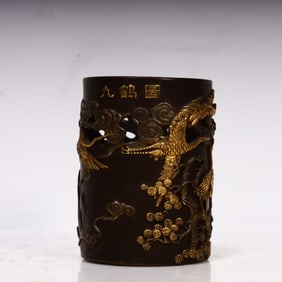 A Qing Dynasty bronze gilt nine-crane figure pen holder